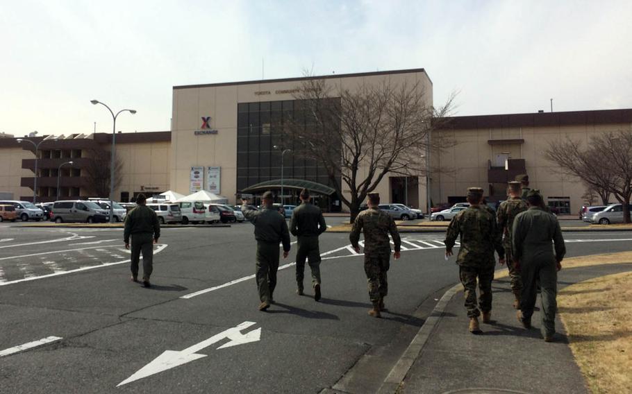 Marines walk toward the Yokota Community Center at Yokota Air Base, Japan, where renovations are adding 25,000 square feet of space to the Base Exchange.