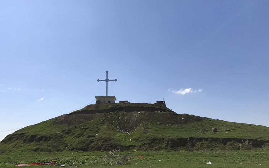 A new cross was raised on a hill on the southern edge of Teleskof facing Mosul, pictured here on Friday, March 24, 2017. The Christian village in Iraq was taken by the Islamic State in August 2014 but was retaken by Kurdish forces. In May 2016, ISIS militants launched an assault on the village in which U.S. Navy SEAL Charles Keating IV was killed.