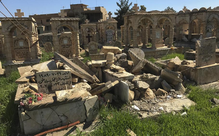 Graves in the cemetery in Teleskof, Iraq, apparently desecrated by Islamic State militants, are pictured here on March 24, 2017. Militants seized the town in August 2014 but were later repelled from it. In May 2016, the terrorist group launched an offensive here that killed U.S. Navy SEAL Charles Keating IV.