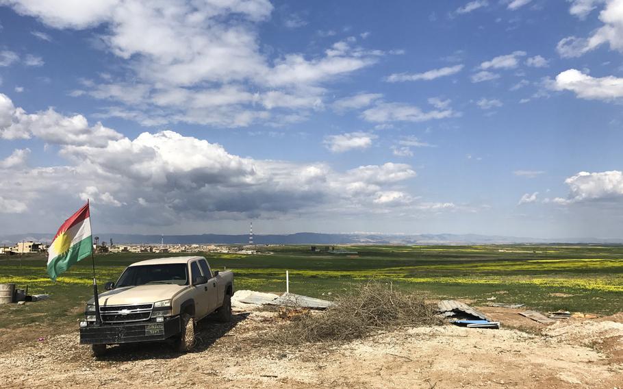 A Kurdish army truck sits near a defensive berm south of the Iraqi Christian village of Batnaya on March 24, 2017. Kurdish forces, known as peshmerga, have pushed the defensive line south, closer to Mosul, in order to prevent a resurgence of Islamic State militants or other groups from advancing on the villages.