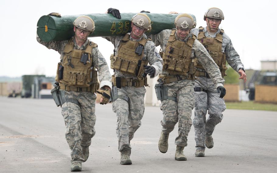 A 435th Security Forces Squadron team carries a log during the inaugural 435th Contingency Response Group Olympics at Ramstein Air Base, Germany, on Friday, May 5, 2017.