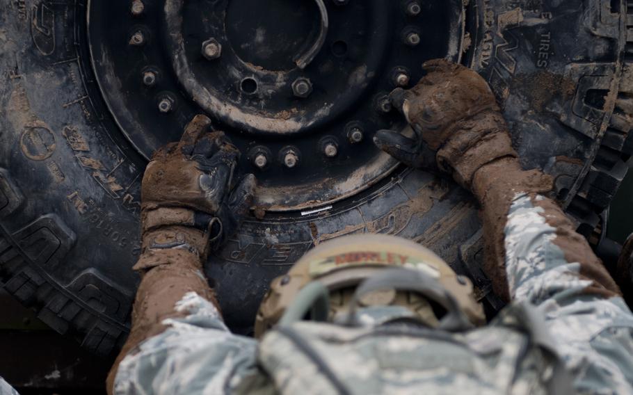 Capt. Robert Moxley, from the 435th Contingency Response Support Squadron, pushes a Humvee during the 435th Contingency Response Group Olympics at Ramstein Air Base, Germany, on Friday, May 5, 2017.