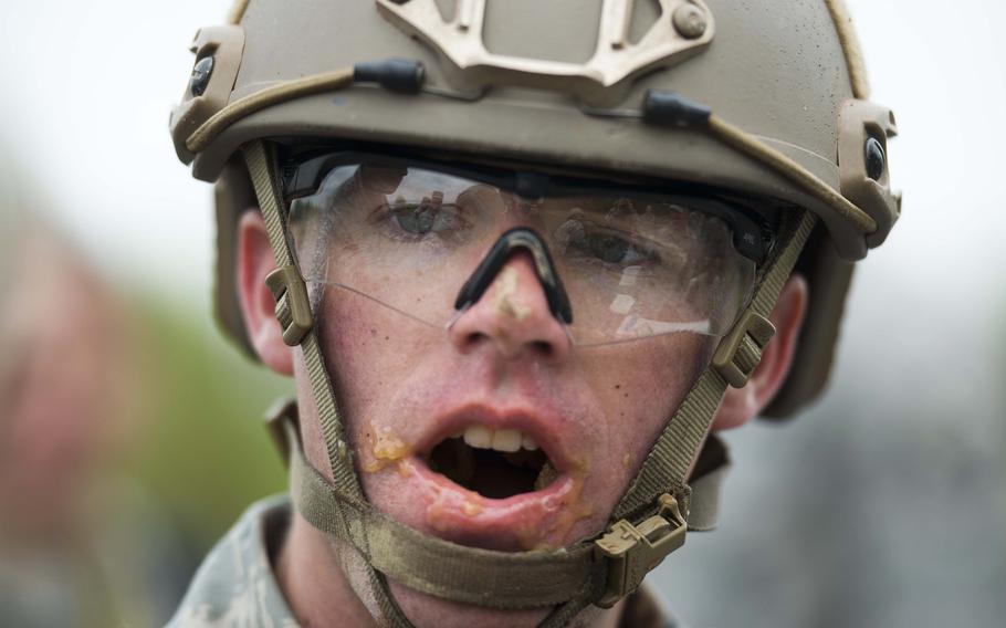 Capt. Robert Moxley, from the 435th Contingency Response Support Squadron, takes a break from eating a Meal Ready to Eat during the 435th Contingency Response Group Olympics at Ramstein Air Base, Germany, on Friday, May 5, 2017.