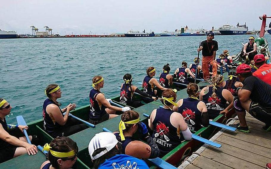 Nirai Kanai, the U.S. Navy Women's Dragon Boat Team, prepares for the race in Naha, Okinawa, Friday, May 5, 2017.