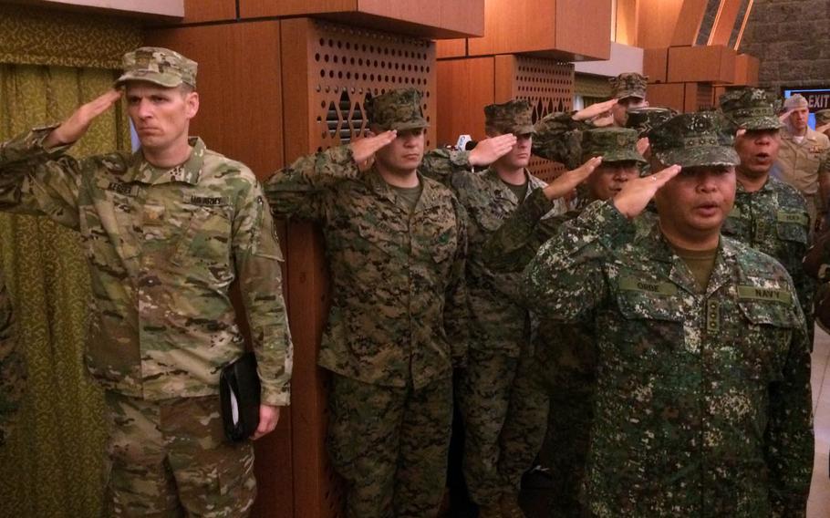 U.S. and Philippine troops salute during a ceremony to kick of annual Balikatan drills at Camp Aguinaldo, Philippines, Monday, May 8, 2017.