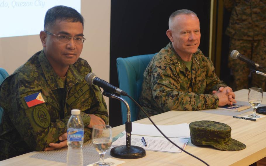 The directors of the Balikatan military exercise, Philippine army Lt. Gen. Oscar Lactao and III Marine Expeditionary Force commander Lt. Gen. Lawrence Nicholson, gave upbeat answers to reporters' questions about the drills at Camp Aguinaldo, Philippines, Monday, May 8, 2017.