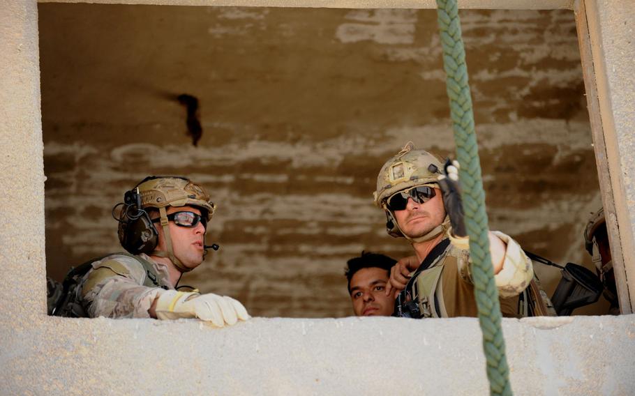 Airmen assigned to personnel recovery troop 2350, prepare to exit a 2nd story window during Exercise Eager Lion in Amman, Jordan, on Monday, May 7, 2017.