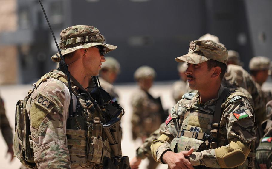 An Air Force Special Tactics Officer discusses safety procedures with a Jordanian officer at the King Abdullah II Special Operations Training Center during Exercise Eager Lion in Amman, Jordan, on Monday, May 7, 2017.