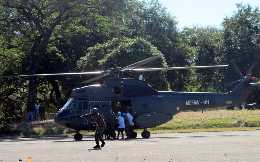 Malawi Defense Force troops, after quelling a simulated protest and taking casualties, evacuate the wounded in a demonstration of Malawi's peacekeeping battalion's expertise on Tuesday, May 9, 2017. The event was part of the African Land Summit 17 hosted by U.S. Army Africa in Lilongwe this week.