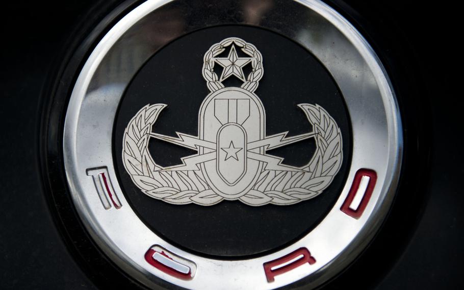 A Master Explosive Ordnance Disposal badge on the trunk of a Ford Mustang at Ramstein Air Base, Germany, April 18, 2017. The Mustang is just one of many of an estimated several hundred souped-up vehicles in the Kaiserslautern Military Community.