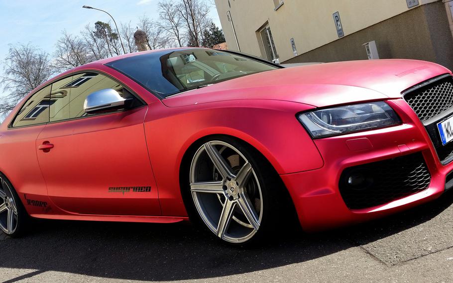 An Audi A5 at Kleber Kaserne, Germany, April 11, 2017, with back tinted windows and other modifications looks primed for the race track. Americans with souped-up cars can drive fast on the German autobahn or on one of the country's amateur race tracks, such as the legendary Nurburgring in the Eifel region.