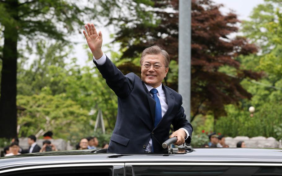 New South Korean President Moon Jae-in waves to supporters in Seoul, Wednesday, May 10, 2017.