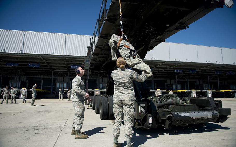 Senior Airmen Christopher Pieczynski, left, and Sarah Isbell assist a simulated fall victim during fall protection training at Ramstein Air Base, Germany, on Wednesday, May 10, 2017. Pieczynski and Isbell are both from the 721st Aerial Port Squadron.