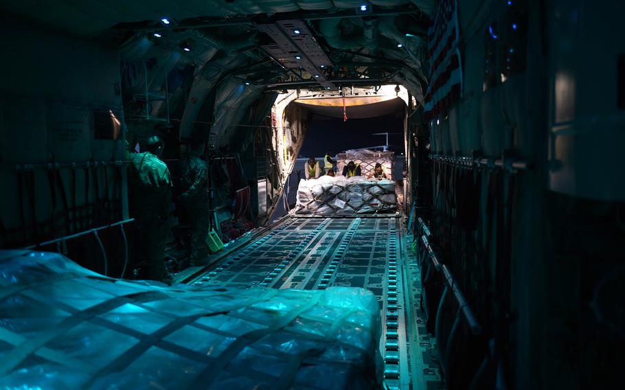 Ground crews load a pallet onto a C-130J from the 774th Expeditionary Airlift Squadron, at Kandahar Air Field, Afghanistan, May 4, 2017.