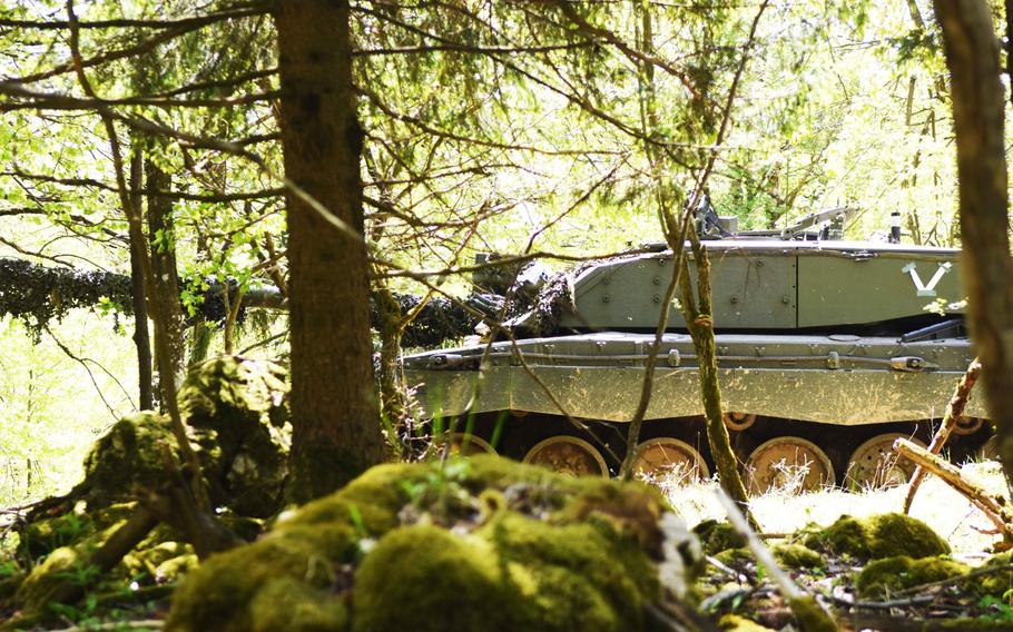 A British Challenger II tank moves through in the forest in Hohenfels, Germany, during Exercise Saber Junction, Wednesday, May 10, 2017.