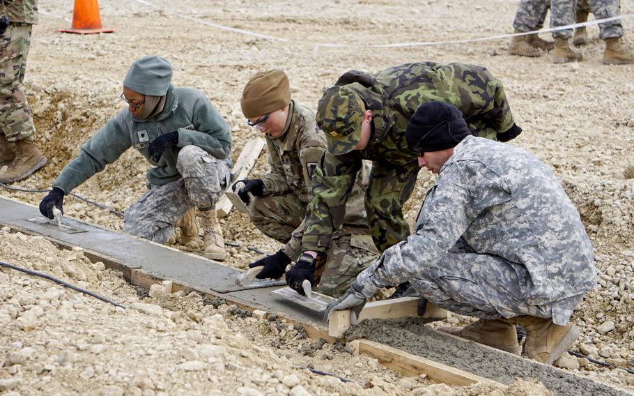 Texas National Guard soldiers from the 236th Engineer Battalion erect a parachute landing fall complex at the Joint Multinational Readiness Center training area in Hohenfels, Germany April 5, 2017. U.S. Army Europe is increasingly utilizing engineer reserve and guard units on its projects across Europe.
