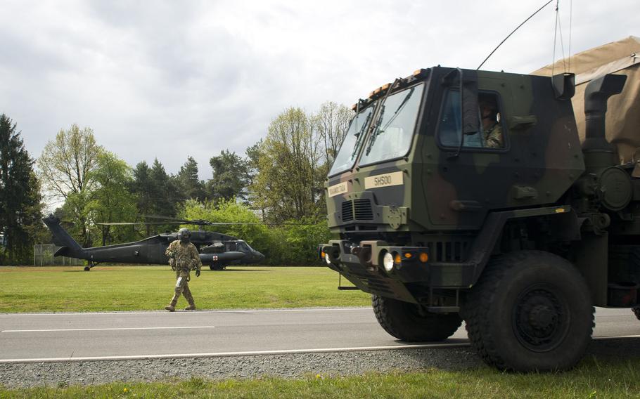 Simulated casualties are driven in prior to being loaded onto a 12th Combat Aviation Brigade Black Hawk during an exercise at Rhine Ordnance Barracks, Germany, on Thursday, May 11, 2017.