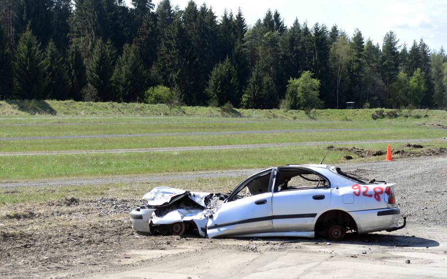 The aftermath of a Ukrainian T-64BM tank driving through the front end of this car, set up as an obstacle at the Strong Europe Tank Challenge at Grafenwoehr, Germany, Thursday, May 11, 2017.
