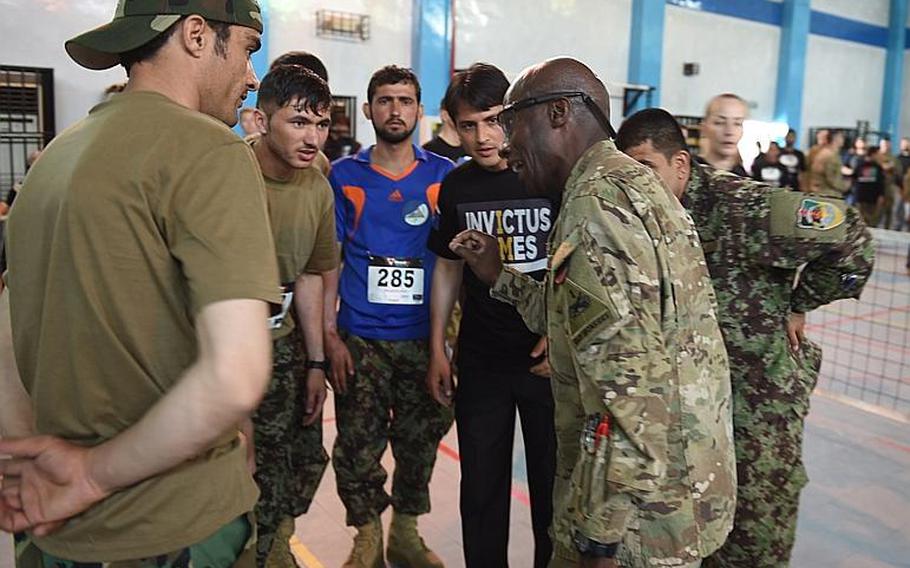 Sgt. Maj. Eugene Russell coaches a group of wounded Afghan soldiers at trials for the Afghan team to the 2017 Invictus Games, at Resolute Support headquarters in Kabul, Afghanistan, Saturday, May 13, 2017.