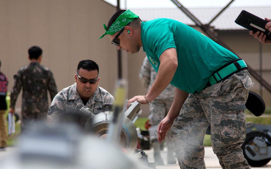 A competitor prepares to move a bomb during the 2017 Annual Load Crew Competition at Kunsan Air Base, South Korea, Saturday, May 13, 2017.