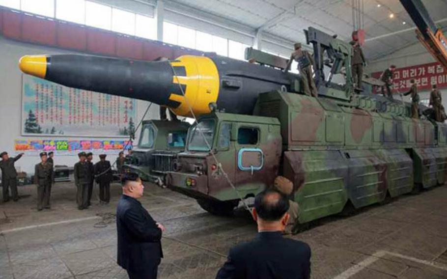 North Korean leader Kim Jong Un is shown watching a missile being loaded onto a launcher in this undated photo published Monday, May 15, 2017, in the official Rodong Sinmun newspaper.