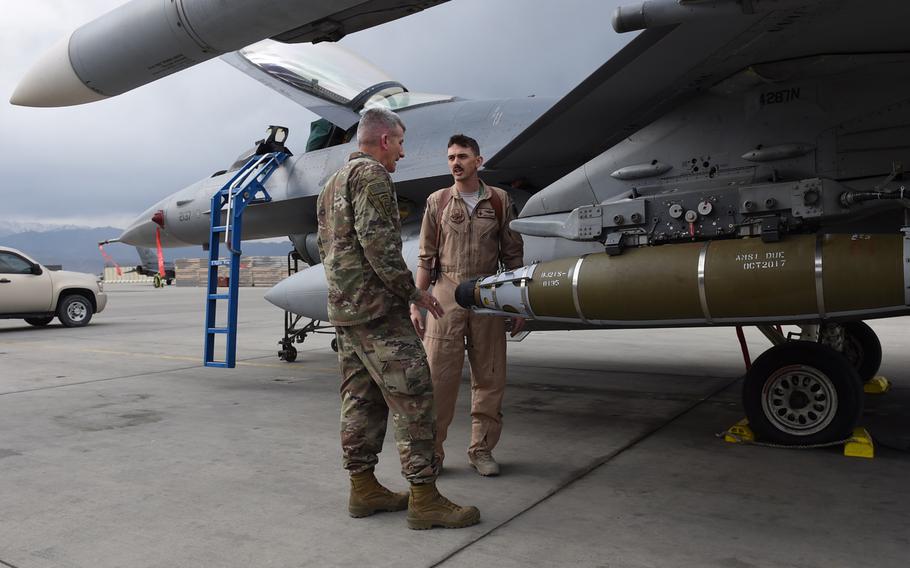 An F-16 pilot from the 555th Fighter Squadron, from Aviano Air Base, Italy, explains to Gen. John Nicholson, the top commander of U.S. forces in Afghanistan, the various ordnance used against terrorist organizations in the country. Nicholson visited pilots and airmen form the 555th at Bagram Air Field, on Saturday, May 13, 2017.
