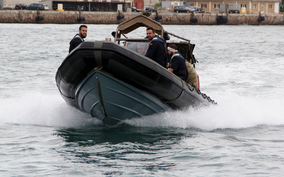 Spanish sailors and U.S. sailors and Coastguardsman use a rigid hull inflatable boat to transit the port of Cartagena in Spain on May 12, 2017 during Phoenix Express. U.S. African Command sponsored the multinational exercise for the purpose of improving maritime policing in the Mediterranean.