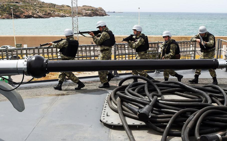 Turkish teams practice tactical movements after they board the Turkish frigate TCG Gokceada onThursday, May 11, 2017 during Phoenix Express in Cartagena, Spain. Sponsored by U.S. Africa Command, the multinational exercis is designed to improve maritime policing in the Mediterranean.