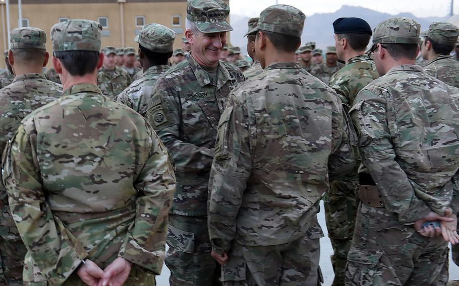 Gen. John Nicholson visited troops serving with NATO Special Operations Component Command-Afghanistan, and gave coins to 18 of them in recognition of their specific contributions to the counter-terrorism fight, on Saturday, May 13, 2017, at Bagram Air Field. Name-tapes have been blurred to protect troops' identities.