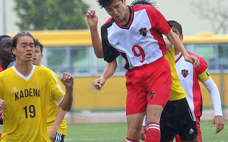 Nile C. Kinnick's Kai Sullivan heads the ball against Kadena during Tuesday's round-robin match in the Far East Boys Division I Soccer Tournament, won by Panthers 3-0. KATRICIA AQUINO/SPECIAL TO STRIPES