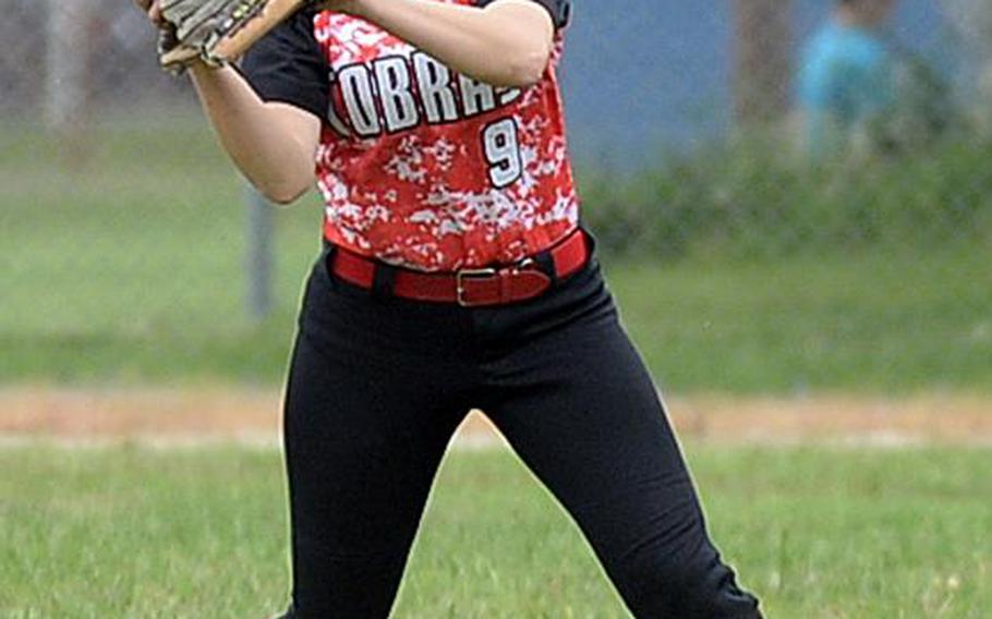 E.J. King's Abigail Skibsted snags a Yokota fly ball during Tuesday's triple-elimination game in the Far East Division II Softball Tournament. The Panthers edged the Cobras 15-14 to keep hope for their third straight title alive. DAVE ORNAUER/STARS AND STRIPES