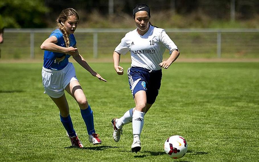 Black Forest Academy's Erin Cho, right, dribbles past Marymount's Matilde Di Tommaso during the DODEA-Europe soccer tournament in Landstuhl, Germany, on Wednesday, May 17, 2017. BFA won the Division II match 1-0. MICHAEL B. KELLER/STARS AND STRIPES