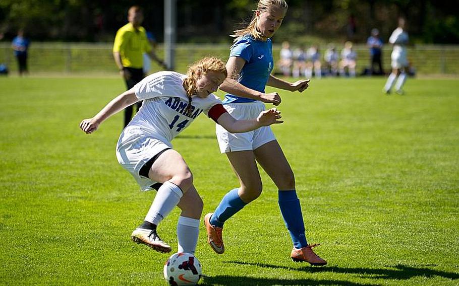 Rota's Emma Hook, left, tries to dribble past Marymount's Arna Mathiesen during the DODEA-Europe soccer tournament in Landstuhl, Germany, on Wednesday, May 17, 2017. Marymount lost the Division II match 1-0. MICHAEL B. KELLER/STARS AND STRIPES