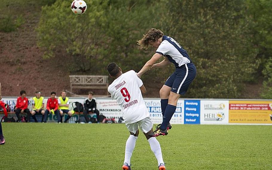Lakenheath's Manny Cordero, right, heads the ball over Kaiserslautern's Pablo Zorrilla during the DODEA-Europe soccer tournament in Reichenbach, Germany, on Thursday, May 18, 2017. Lakenheath lost the Division I match 5-0. MICHAEL B. KELLER/STARS AND STRIPES