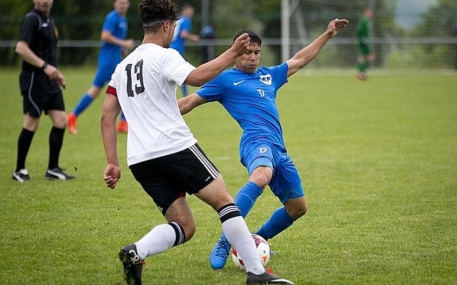 Ramstein's Dante Lapitan, right, gets the ball away from Vicenza's Christopher Ortiz during the DODEA-Europe soccer tournament in Reichenbach, Germany, on Thursday, May 18, 2017. Ramstein and Vicenza tied the Division I match 1-1 and Ramstein advances to the semifinals. MICHAEL B. KELLER/STARS AND STRIPES