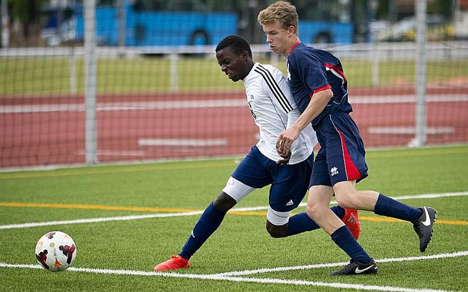 Aviano's Liam Knowles, right, and Black Forest Academy's Sam Musee race for the ball during the DODEA-Europe soccer tournament in Kaiserslautern, Germany, on Thursday, May 18, 2017. Aviano won the Division II match 1-0. MICHAEL B. KELLER/STARS AND STRIPES