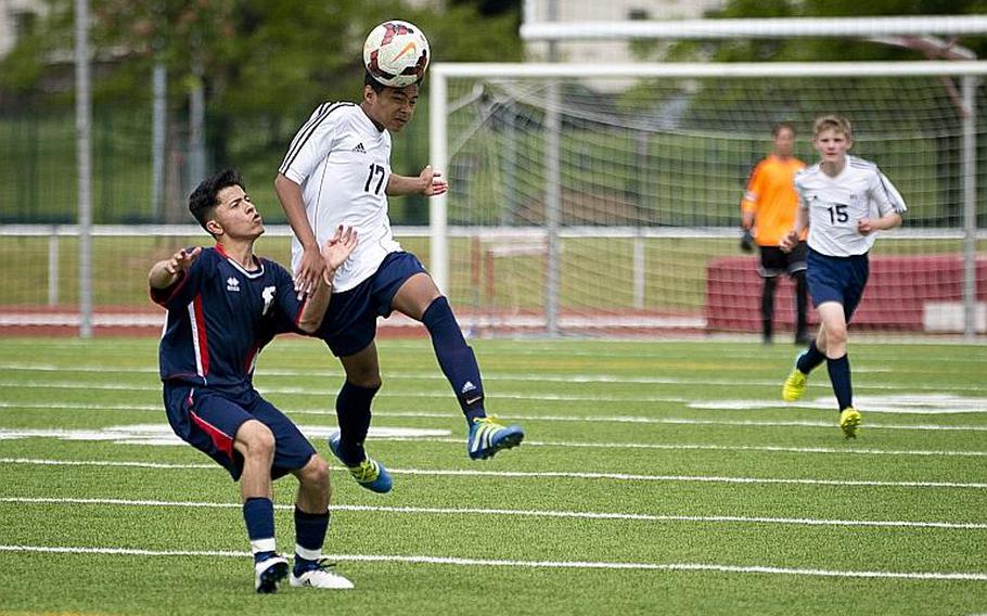 Black Forest Academy's Branch Walton, right, heads the ball over Aviano's Jason Valladares Rivera during the DODEA-Europe soccer tournament in Kaiserslautern, Germany, on Thursday, May 18, 2017. BFA lost the Division II match 1-0. MICHAEL B. KELLER/STARS AND STRIPES