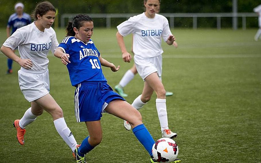 Rota's Avery Nance passes the ball ahead of Bitburg's Chloe Smith, right, and Tahlia Mower during the DODEA-Europe Division II semifinals in Reichenbach, Germany, on Friday, May 19, 2017. Rota lost the match 3-1 after a shootout. MICHAEL B. KELLER/STARS AND STRIPES