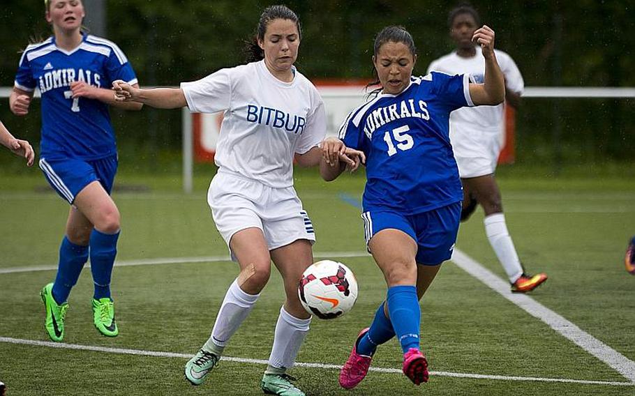 Bitburg's Emma Passig, left, and Rota's Jasmine Garrison race for the ball during the DODEA-Europe Division II semifinals in Reichenbach, Germany, on Friday, May 19, 2017. Bitburg won the match 3-1 after a shootout. MICHAEL B. KELLER/STARS AND STRIPES