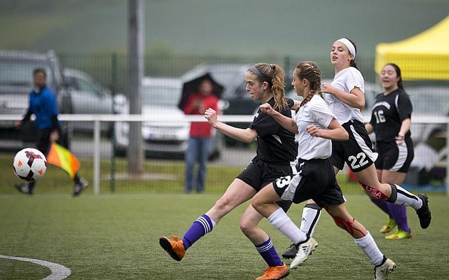 Bahrain's Zoie Howes shoots the ball ahead of AFNORTH's Carolyn Mote, right, and Kyla Kolosky during the DODEA-Europe Division II semifinals in Reichenbach, Germany, on Friday, May 19, 2017. Bahrain lost the match 2-1 in double overtime. MICHAEL B. KELLER/STARS AND STRIPES