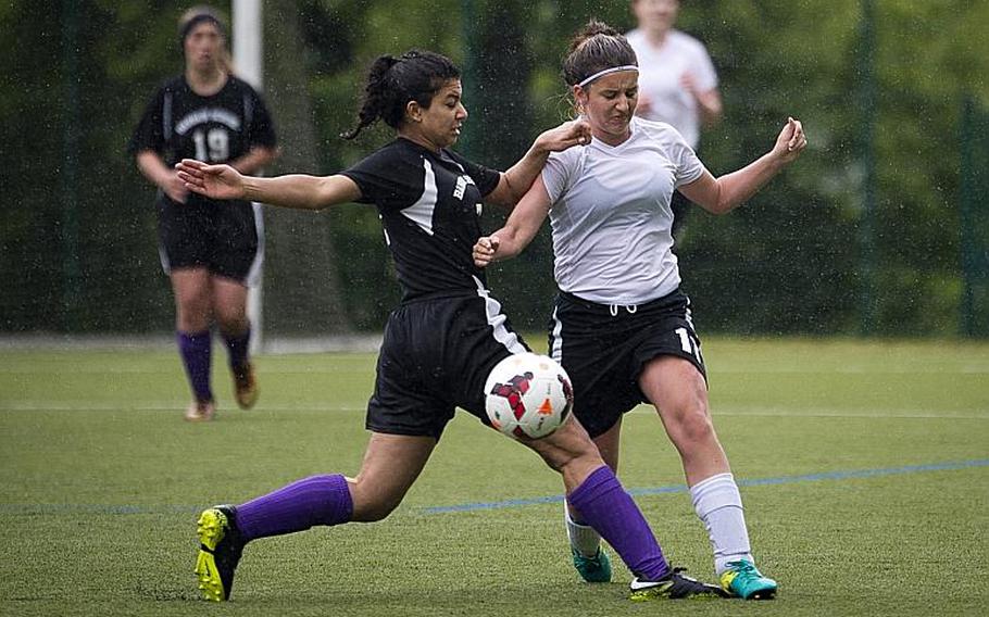 AFNORTH's Kayla Lambiase, right, and Bahrain's Asmaa Hussein battle for the ball during the DODEA-Europe Division II semifinals in Reichenbach, Germany, on Friday, May 19, 2017. AFNORTH won the match 2-1 in double overtime. MICHAEL B. KELLER/STARS AND STRIPES