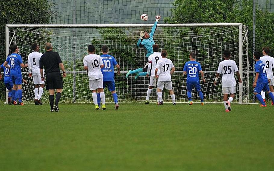 Naples keeper Joseph Crews knocks a dangerous Ramstein corner kick over the crossbar in a Division I semifinal at the DODEA-Europe soccer championships in Reichenbach, Germany. Ramstein beat Naples 1-0 in overtime to advance to Saturday's final.