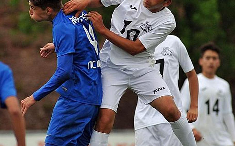 Naples' Nicolas Mihalik gets the header over Ramstein's Gavin McMillan in a Division I semifinal at the DODEA-Europe soccer championships in Reichenbach, Germany. Ramstein beat Naples 1-0 in overtime to advance to Saturday's final.