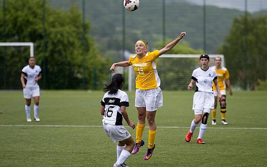 Stuttgart's Adan Maher, right, jumps for a header over Ramstein's Anna Abell during the DODEA-Europe Division I semifinals in Reichenbach, Germany, on Friday, May 19, 2017. Stuttgart won the match 4-0. MICHAEL B. KELLER/STARS AND STRIPES