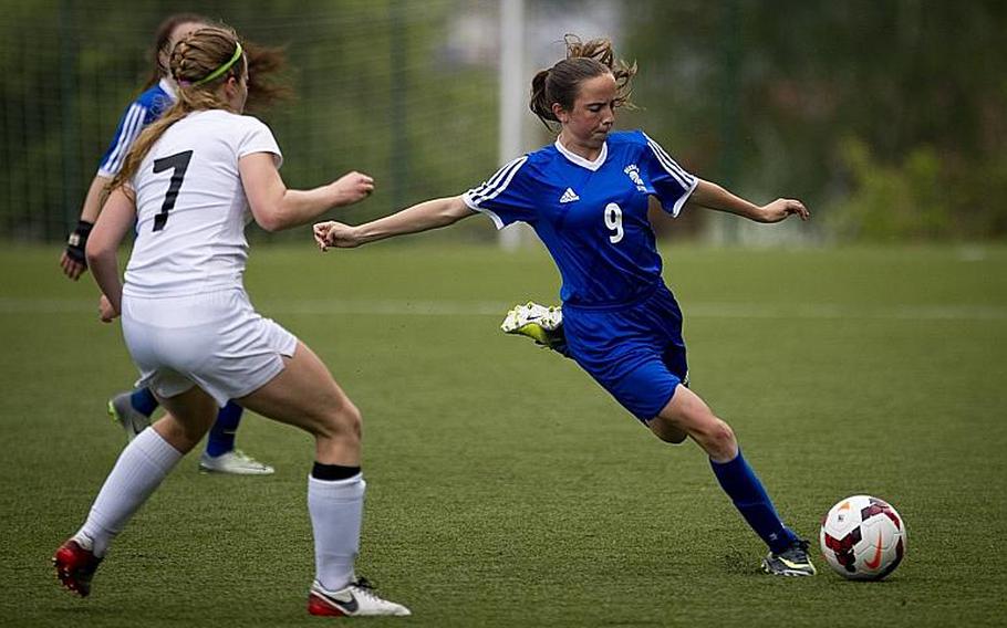 Wiesbaden's Erin Goodman, right, gets ready to pass the ball past Naples' Adah Barenburg during the DODEA-Europe Division I semifinals in Reichenbach, Germany, on Friday, May 19, 2017. Wiesbaden won the match 3-1. MICHAEL B. KELLER/STARS AND STRIPES