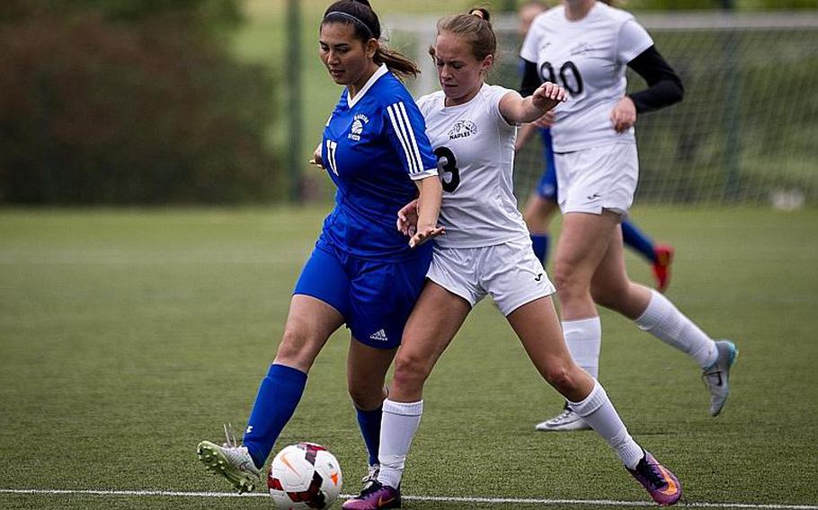 Naples' Cora Houseworth, right, challenges Wiesbaden's Elizabeth Hall for the ball during the DODEA-Europe Division I semifinals in Reichenbach, Germany, on Friday, May 19, 2017. Naples lost the match 3-1. MICHAEL B. KELLER/STARS AND STRIPES