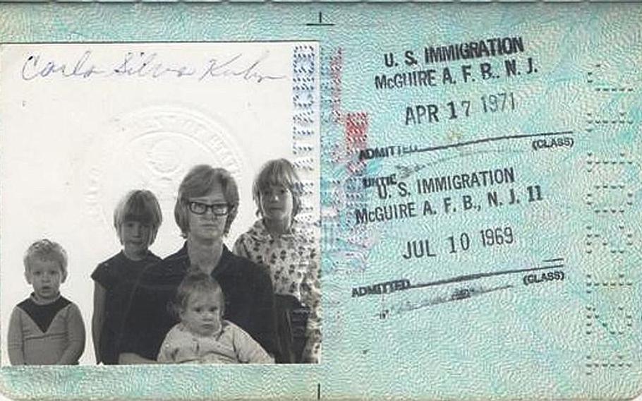 Elizabeth Kuhn is pictured, from left to right, with her brother, Billy, and sisters Mary and Katrina, and held by her mother, Carla Syliva Kuhn, in the family's passport photo. Elizabeth died at 20 months of age in 1968. She is buried in the Kindergraves in the Kaiserslautern city cemetery in Germany. 