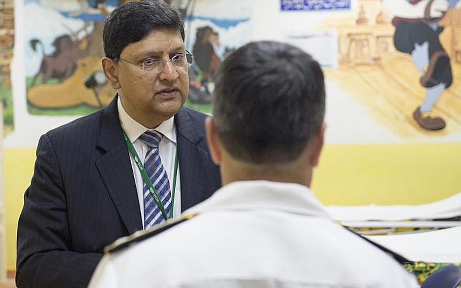 American Mission Hospital chief medical officer George Cheriyan shows Vice Adm. Kevin M. Donegan, U.S. Naval Forces Central Command commander, the children's ward of the hospital on Sunday, May 21, 2017, where the walls are covered in Disney artwork painted by U.S. Navy sailors years ago. 
                