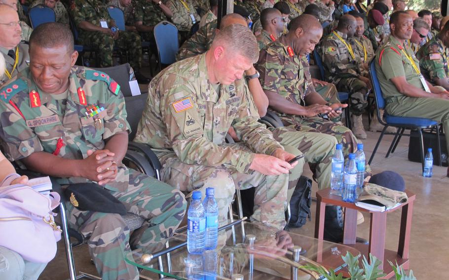 Maj. Gen. Joseph Harrington, commander of U.S. Army Africa, sits to the right of Malawi's defense forces chief Gen. Griffin Spoon Phiri at a peacekeeping demonstration in the Malawian capital during the African Land Forces summit on May 9, 2017. Next year's summit will be in Nigeria.