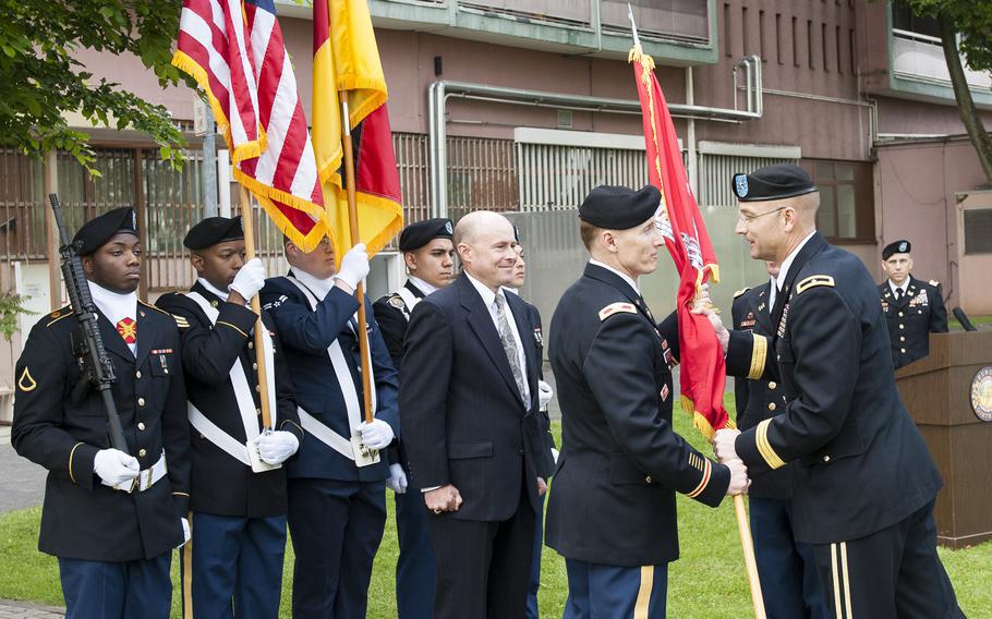 Col. John K. Baker, incoming commander of U.S. Army Corps of Engineers Europe District, accepts the colors from Brig. Gen. William H. Graham, USACE North Atlantic Division commander, during a change-of-command ceremony May 24, 2017, at the Amelia Earhart Center in Wiesbaden, Germany.